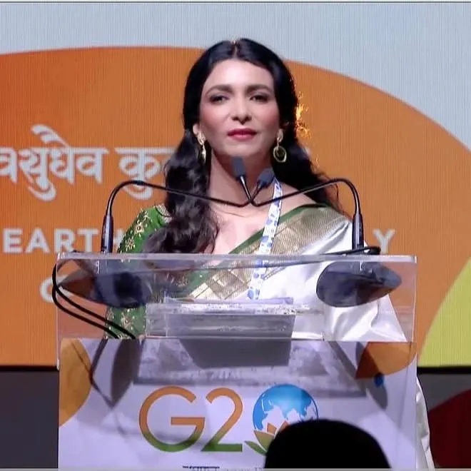 Here I am addressing delegates at a G20 summit meeting. Hosting events of this scale requires immense preparation, poise, and the ability to command a room with clarity and grace. This is the level of professionalism and stage presence I help my clients cultivate in their own public speaking, whether they are on a global stage or in a boardroom.