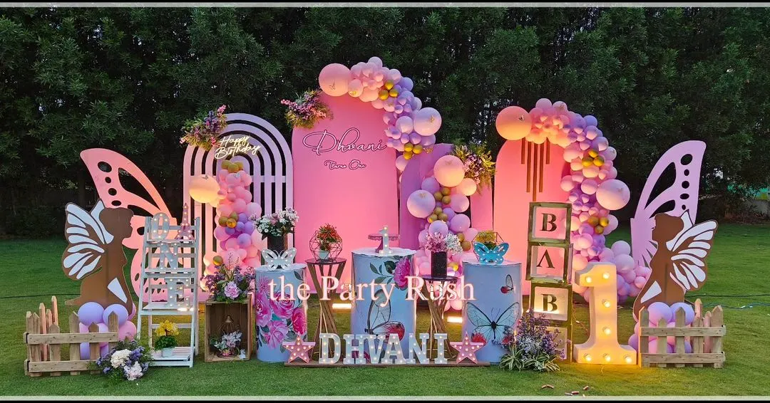 For Dhvani's first birthday, I designed this breathtaking butterfly-themed party in a beautiful garden setting. The decor features large, intricate butterfly wings, soft pink backdrops, and marquee lights, all coming together to create a magical outdoor celebration.