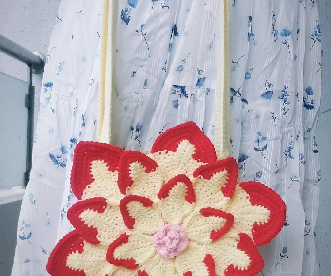 This is my custom-made Lotus Bag, a vibrant and playful shoulder bag that brings a pop of color to any outfit. The layered petal design is a great example of how I can turn a simple accessory into a piece of wearable art.