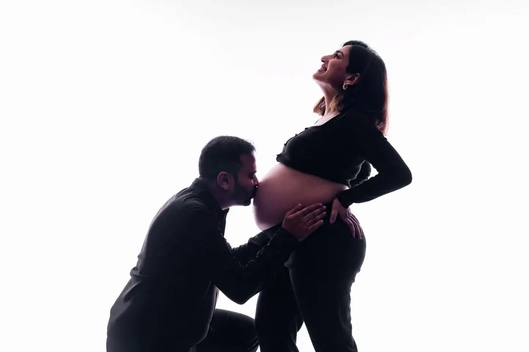 This is one of our favorite ways to capture the anticipation of pregnancy. A silhouette shot like this creates a timeless and artistic portrait, focusing on the beautiful bond between partners as they wait for their little one.
