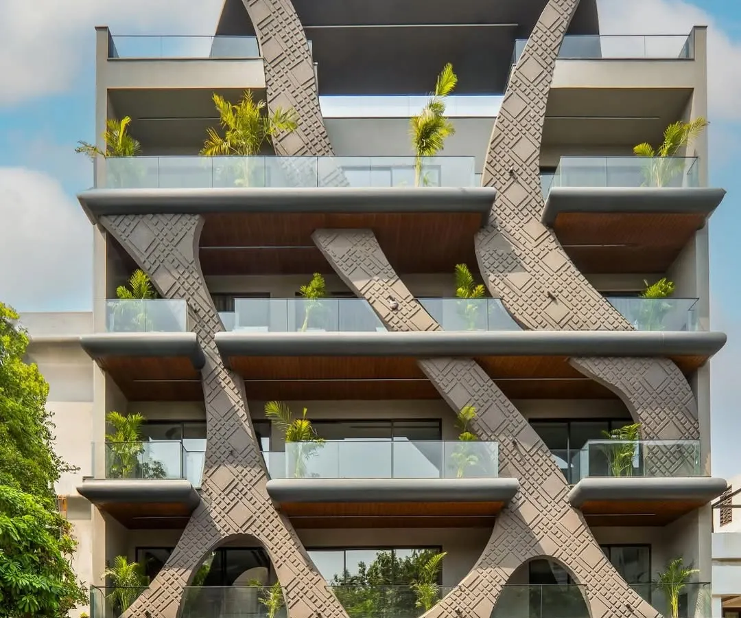 Inspired by the fluidity of natural wave forms, this residential facade in Gurgaon showcases my passion for sculptural architecture. The design uses concrete grooving and a stone finish to create a dynamic, organic structure that is both a home and a piece of art.