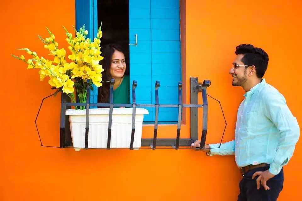 This was a fun, themed pre-wedding shoot with a 'Romeo and Juliet' concept. I used the vibrant colors of the location and creative posing to capture a playful, romantic moment that feels unique to the couple.