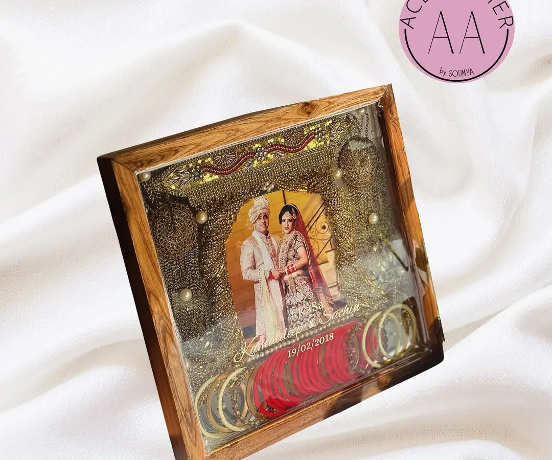 Your bridal story doesn't end with the wedding. I preserved this bride's precious kaleeras, chuda, and wedding photo in a deep teakwood frame, creating a stunning piece of wall art filled with memories.