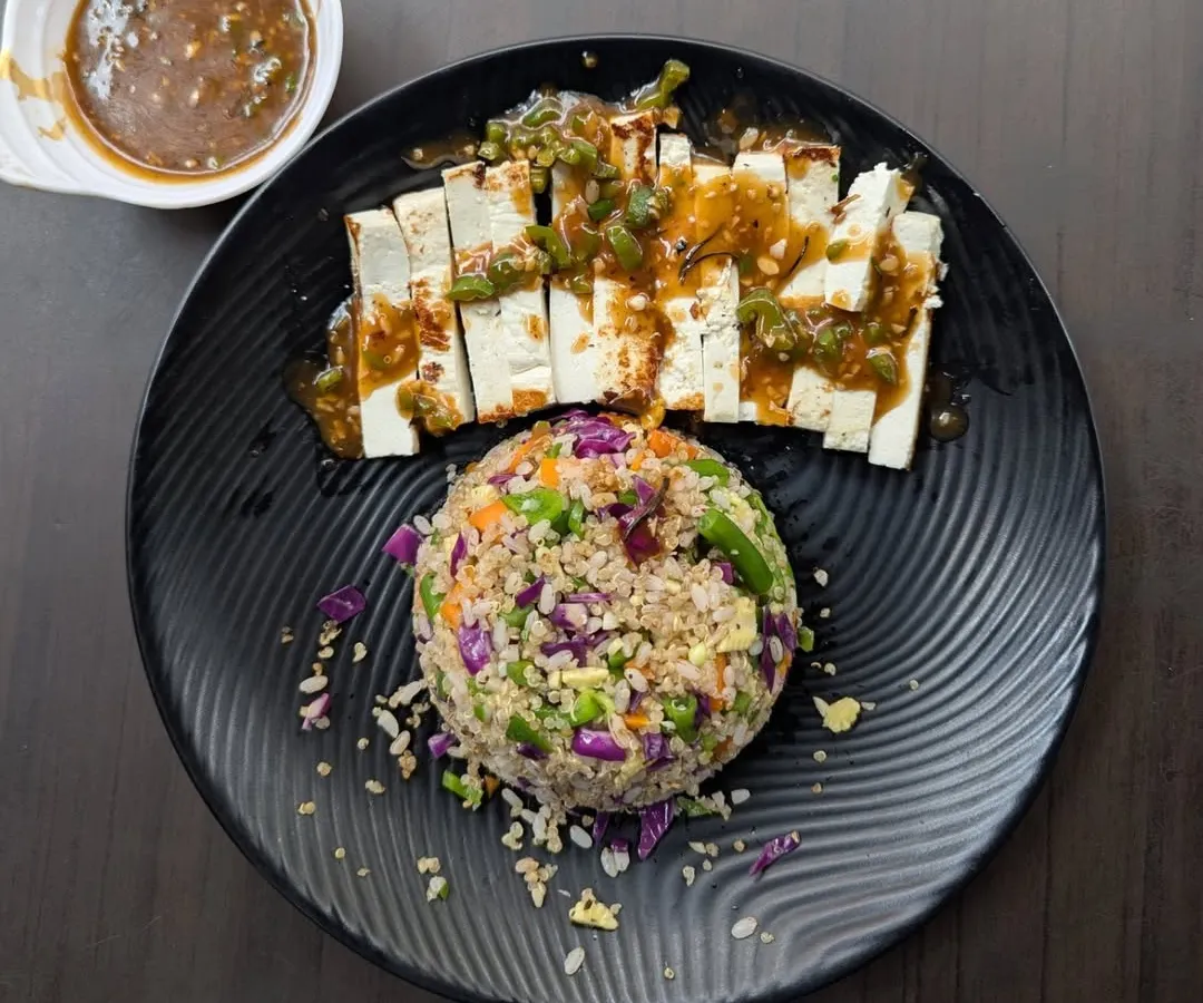 A look at our expertly plated Tofu meal, served with a colorful and nutritious scoop of mixed-grain rice. This dish showcases our focus on creating balanced vegetarian meals that are both flavorful and satisfying.