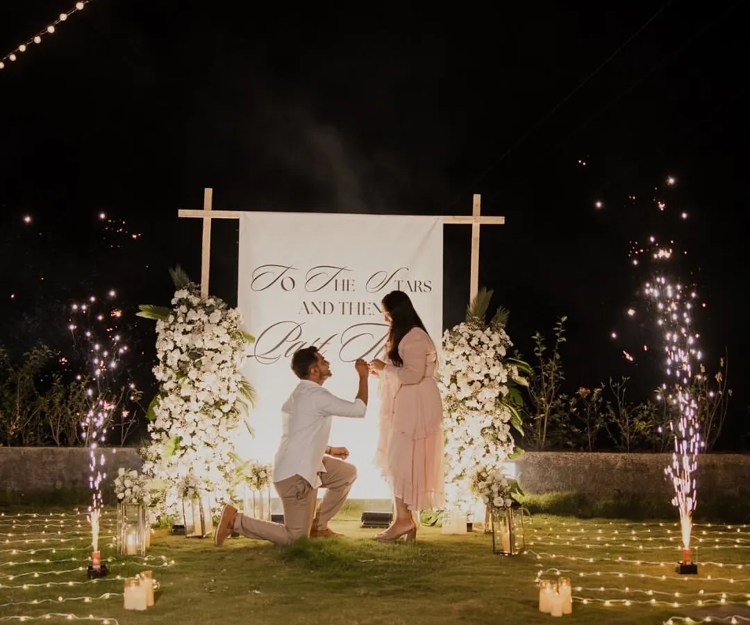 The perfect "Yes" moment. I design the entire experience, from the candlelit path and floral backdrop to the perfectly timed sparklers, ensuring your proposal is a story you will tell forever.