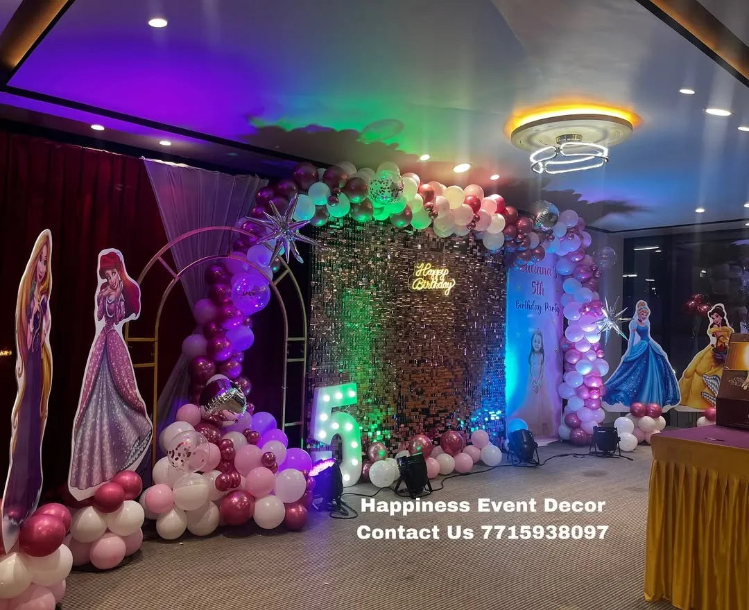 I create magical princess-themed birthday parties like this one. This premium setup includes a sparkling sequin backdrop, a balloon arch in the theme's colors, and life-sized cutouts of popular princesses to complete the fairy tale look.