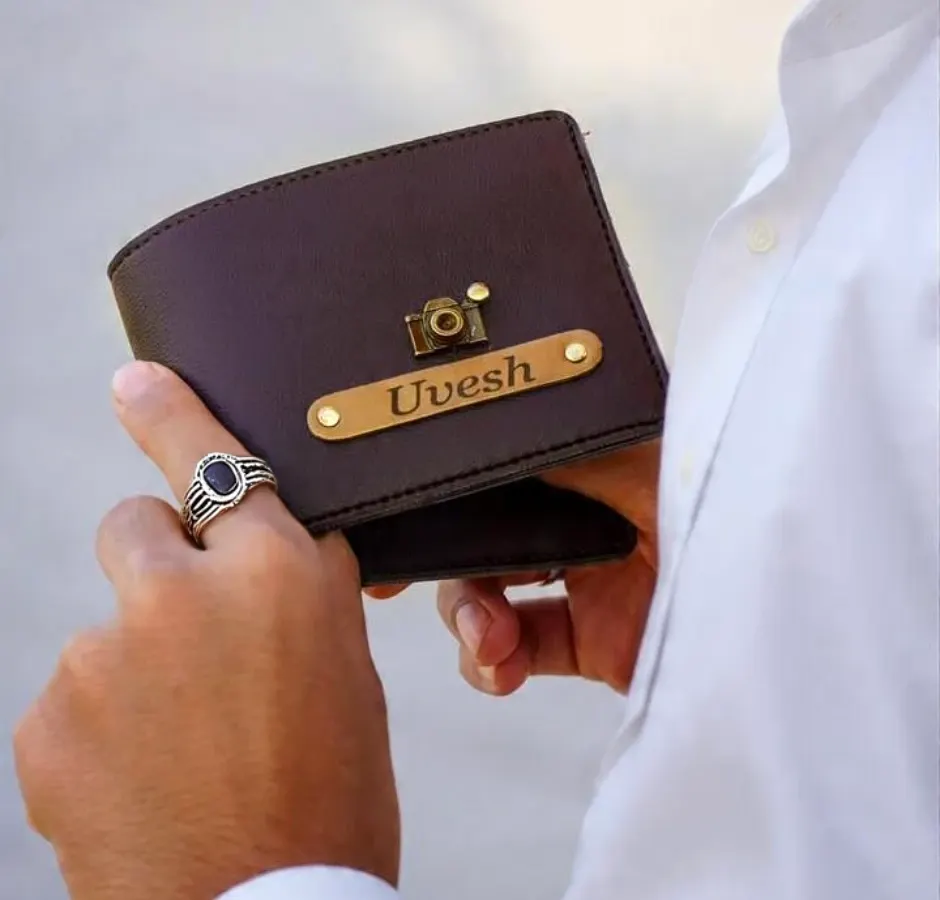 A gift that he will carry with him always. This is a close-up of my personalized leather wallet, customized with a name and a camera charm, showing the fine quality and personal touch that makes it special.