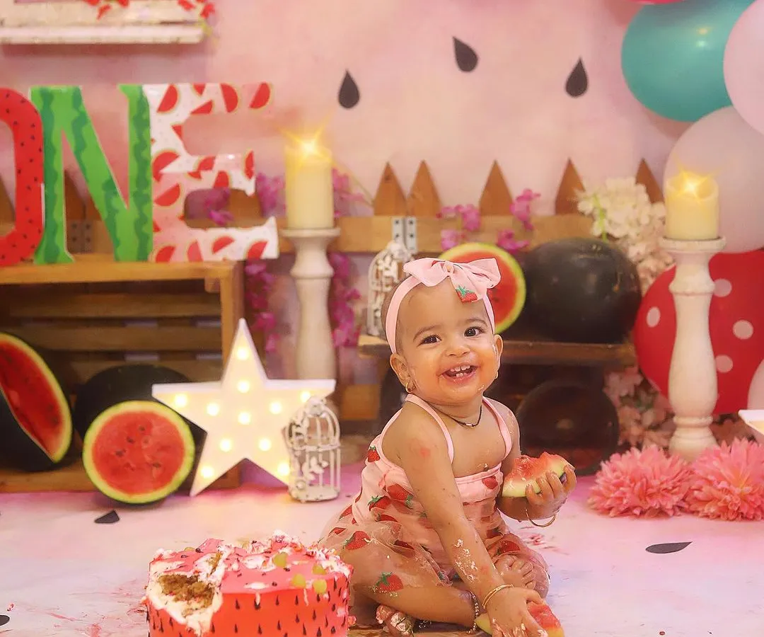 This happy smile says it all! A "One in a Melon" themed cake smash is such a fun and colourful way to celebrate a first birthday. I love capturing the pure joy as they dig into their very own watermelon cake.