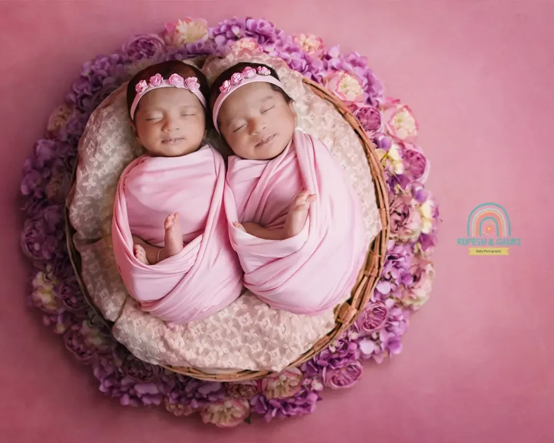 There's something truly magical about newborn twins. We specialize in creating serene and beautiful portraits like this one, ensuring your little ones are safe and comfortable throughout the session at your home or our studio.