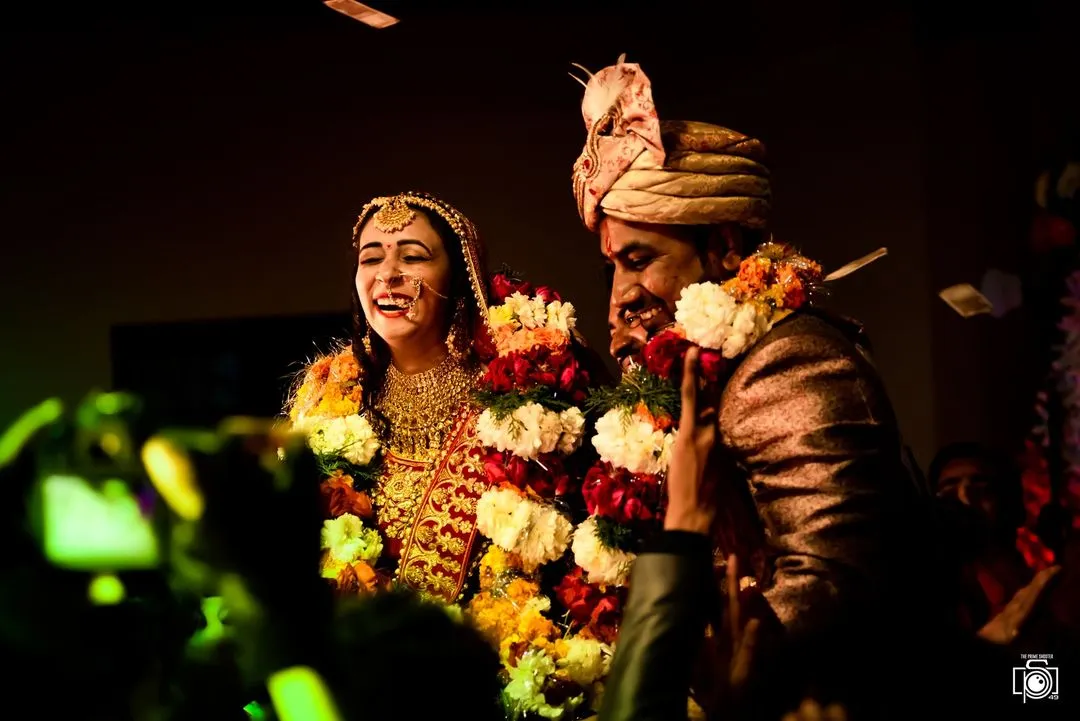 The Varmala is a moment of pure, unscripted joy. I live for capturing these candid smiles and laughter between a couple, the real moments that become the most cherished memories.