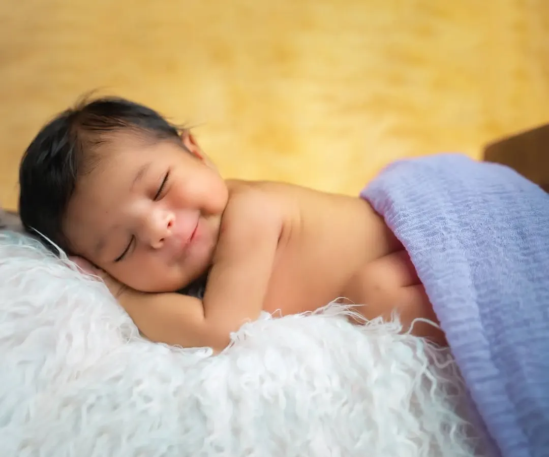 There is nothing more precious than a newborn's smile. We capture these fleeting moments in our cozy studio, ensuring your baby is safe, comfortable, and peacefully asleep for their first infant photoshoot.