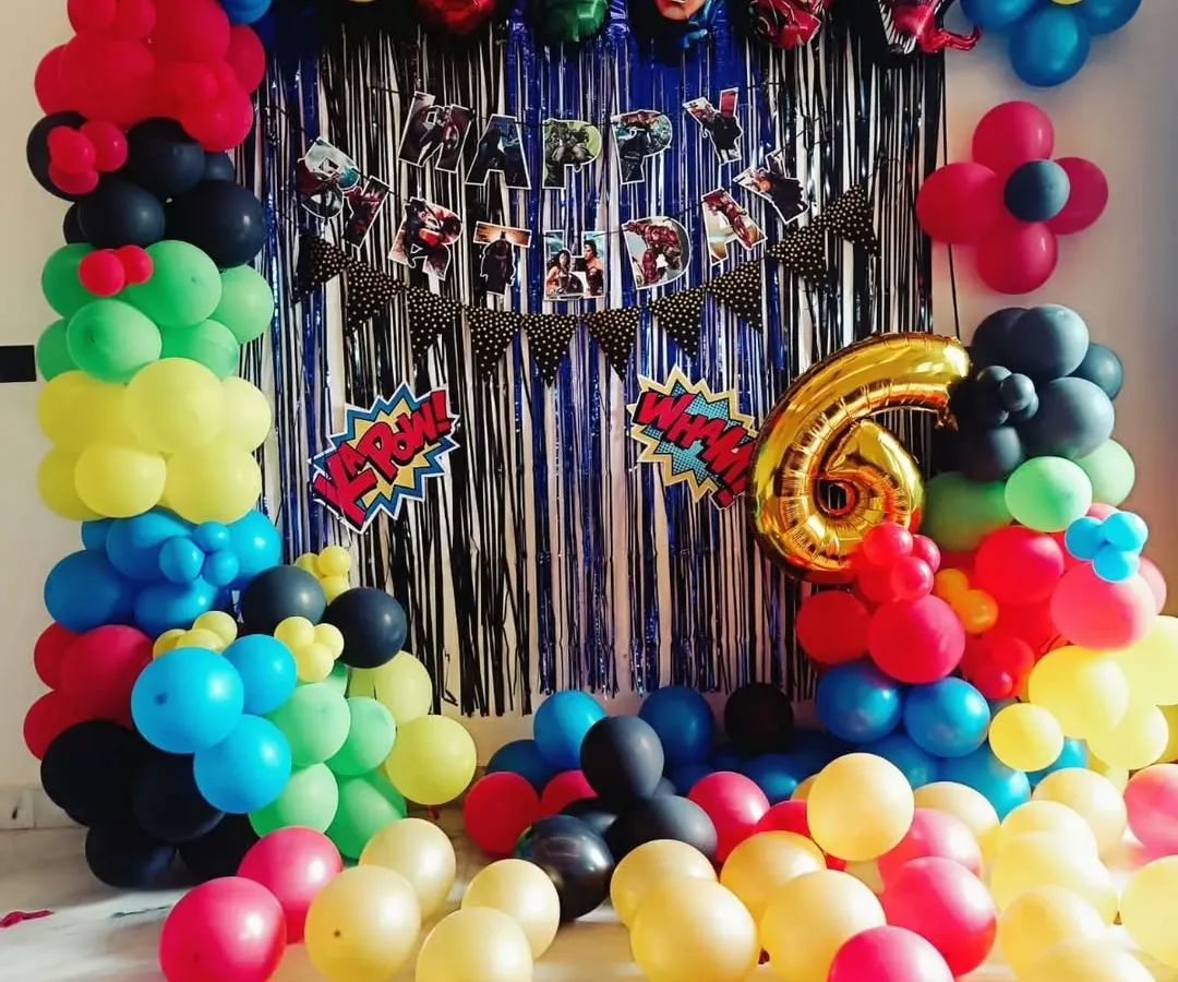 For a 6th birthday, I created this action-packed Avengers superhero theme. The setup includes a full balloon arch, character foil balloons of Spiderman and Hulk, and a themed "Happy Birthday" banner against a shimmer curtain.