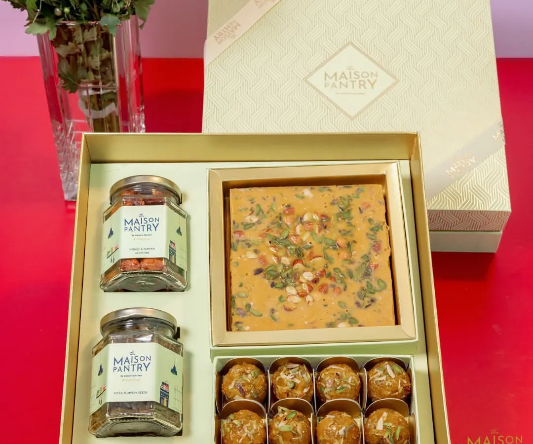 This is where tradition meets modern elegance. My premium gift hampers, like this one featuring artisanal mithai, laddoos, and savory nuts, are thoughtfully curated and beautifully packaged to make your festive gifting truly special.