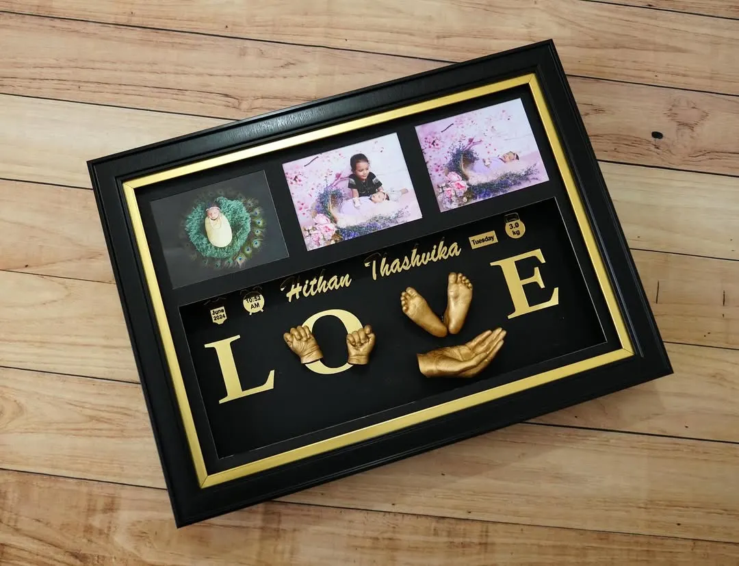 This 'LOVE' family sculpture is one of my favorite designs to create. Here, I combined the hand and foot casts of siblings Hithan and Thashvika with their photos to create a beautiful testament to their bond, all set in a classic black and gold frame.