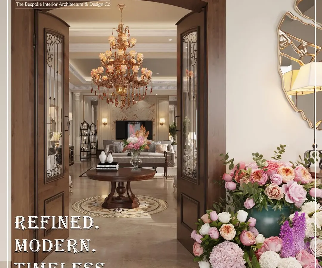 The first impression of a home should tell a story of what lies within. I designed this grand entrance with classic wooden doors, a statement chandelier, and fresh florals to create a warm, opulent welcome that is refined, modern, and timeless.