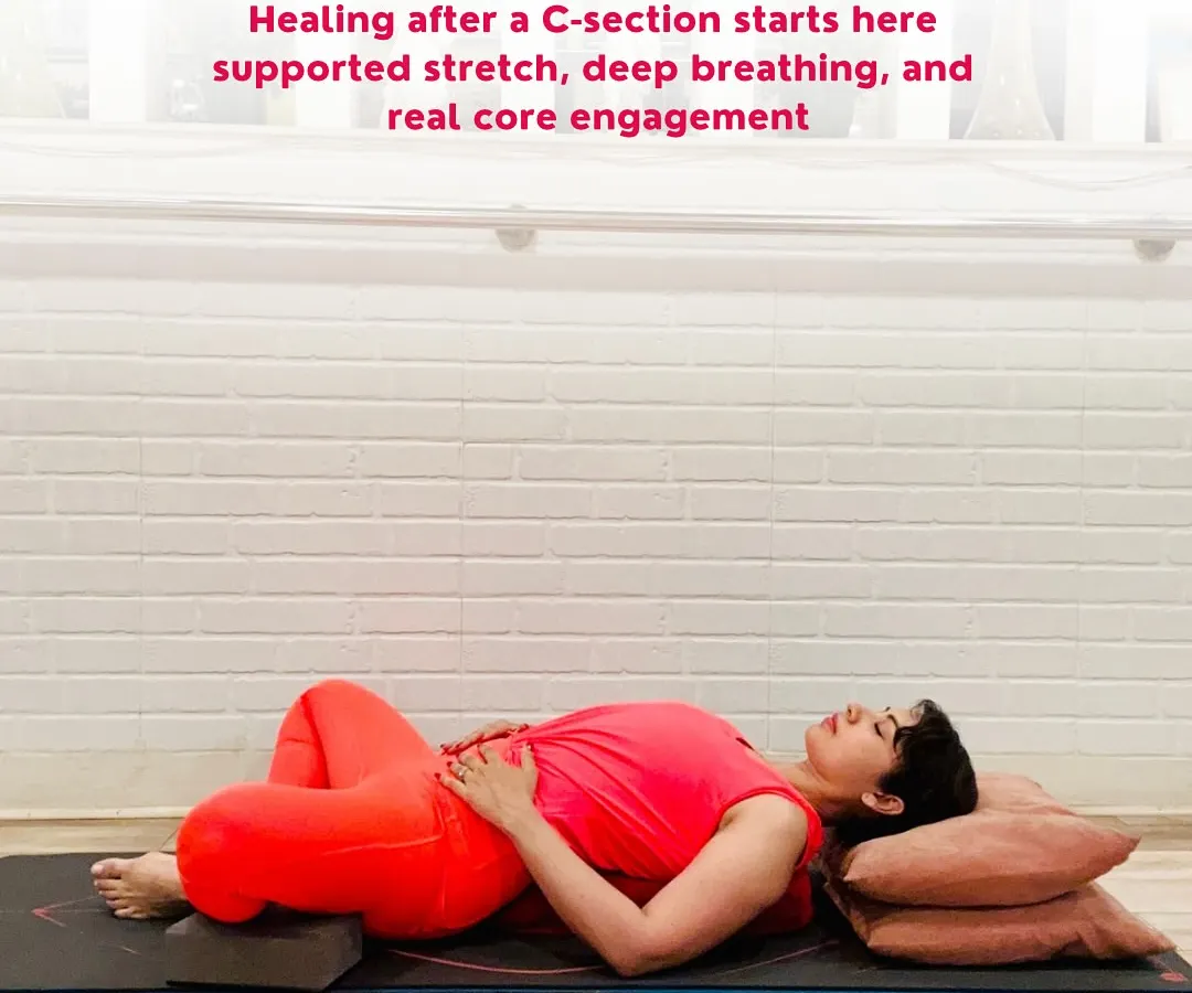 Healing after a C-section begins with gentleness and deep connection. This supported restorative pose is fundamental to my postpartum recovery program. With pillows for support and hands on the belly, we encourage deep diaphragmatic breathing to gently engage the core, soothe scar tension, and create a safe space for the body to heal.