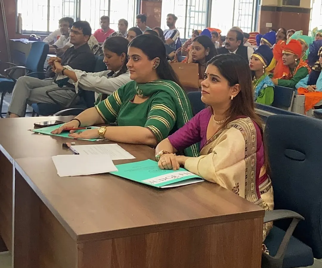My judging process is one of deep observation and respect for each performer's journey. Here I am, fully engrossed in a performance at the School of Specialized Excellence, carefully considering the technical skill, creativity, and emotional depth of the presentation.
