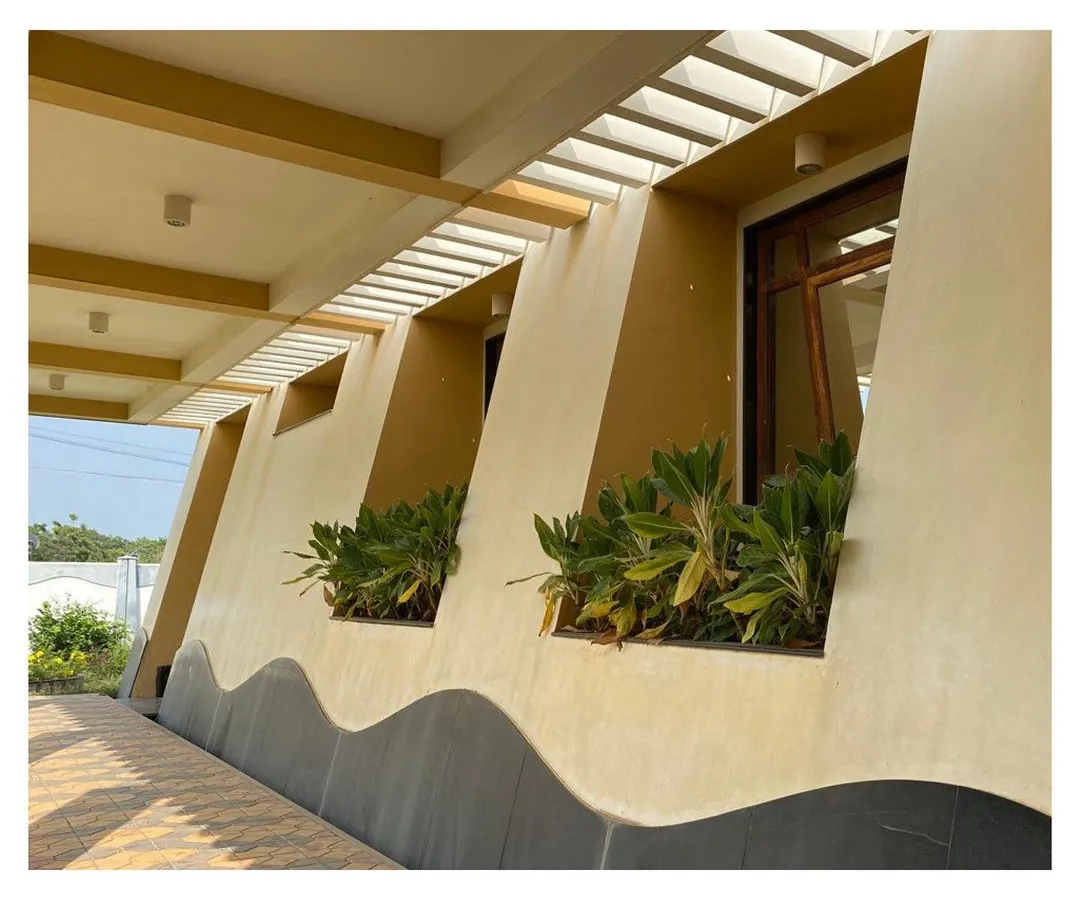 This detail from our CC Office project shows how we integrate landscape directly into the building's facade. The deep, recessed sills become planters, a technique we use to create site-sensitive resort architecture that feels connected to nature.