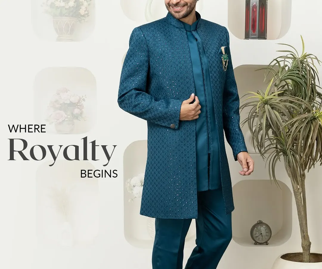 This striking teal Indo-Western sherwani is where royalty begins. The rich, textured fabric and long, structured silhouette offer a modern take on traditional groomswear, perfect for making a grand entrance.