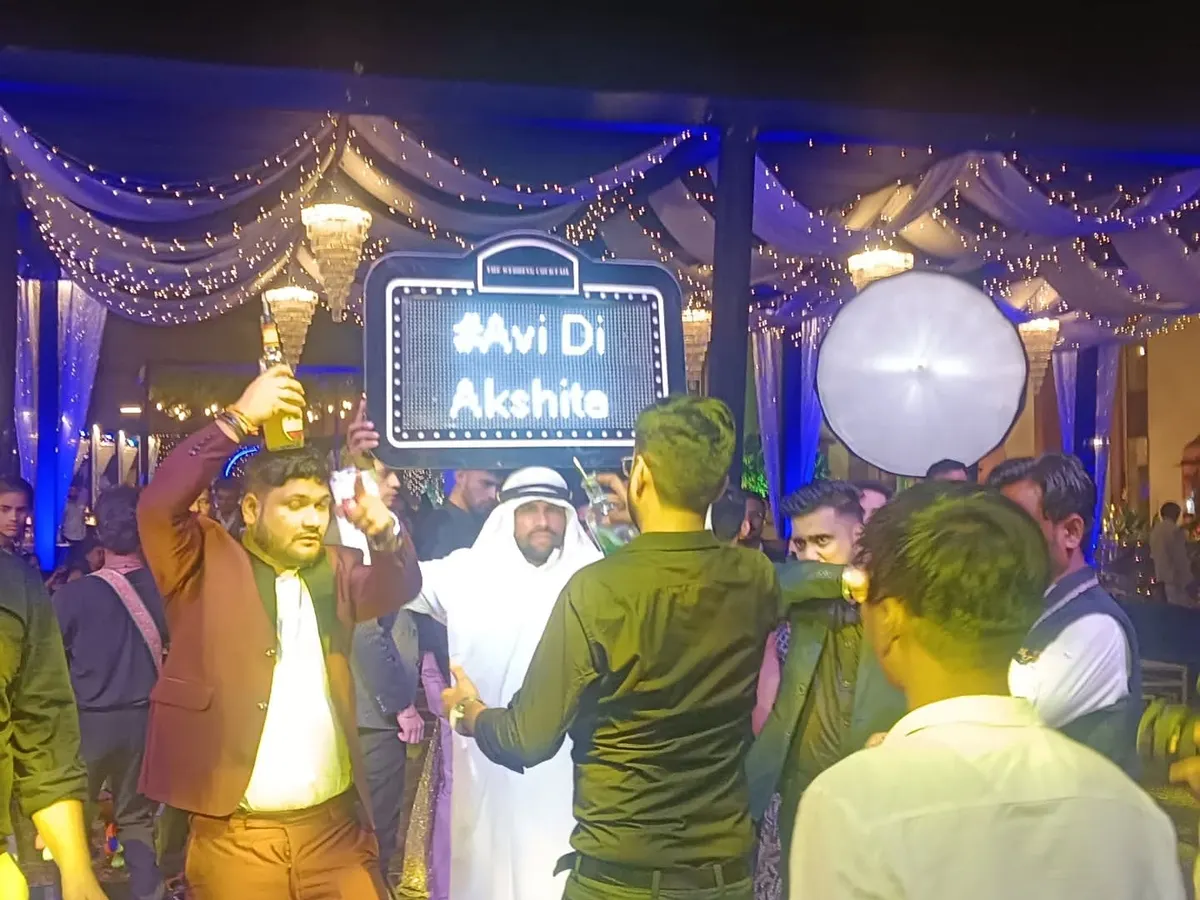 I bring the party to the dance floor with our famous "Habibi" act, serving shots and getting everyone hyped. We can even include a custom light-up sign with your wedding hashtag.
