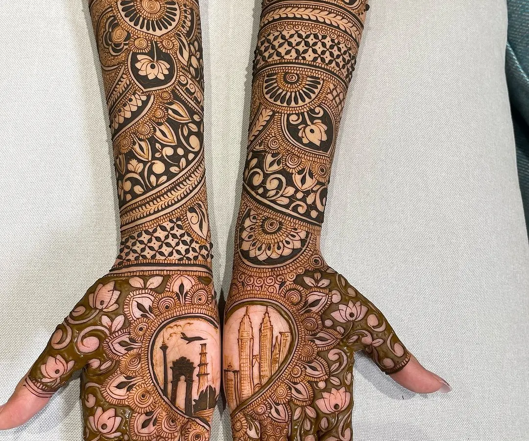Your mehandi can be a canvas for what's special to you. For this bride, we included landmarks from her love story, featuring the India Gate and the Petronas Towers, blending personal memories with traditional bridal art.
