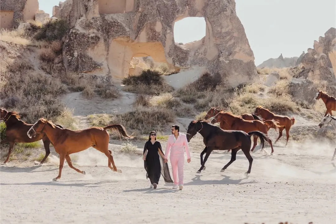 A moment straight out of a fairytale in Cappadocia, Turkey. We orchestrated this incredible shot with Kashish and Simran walking hand-in-hand as wild horses ran alongside them, creating a powerful and unforgettable image of their journey together.