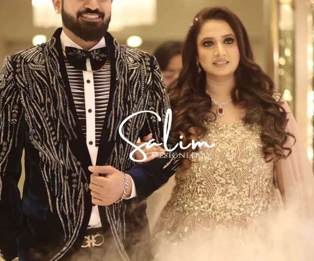 A client looking sharp and confident on his special day. He's wearing a custom-designed velvet tuxedo with intricate tonal embroidery, a piece we created together to be both elegant and memorable for his wedding celebration.
