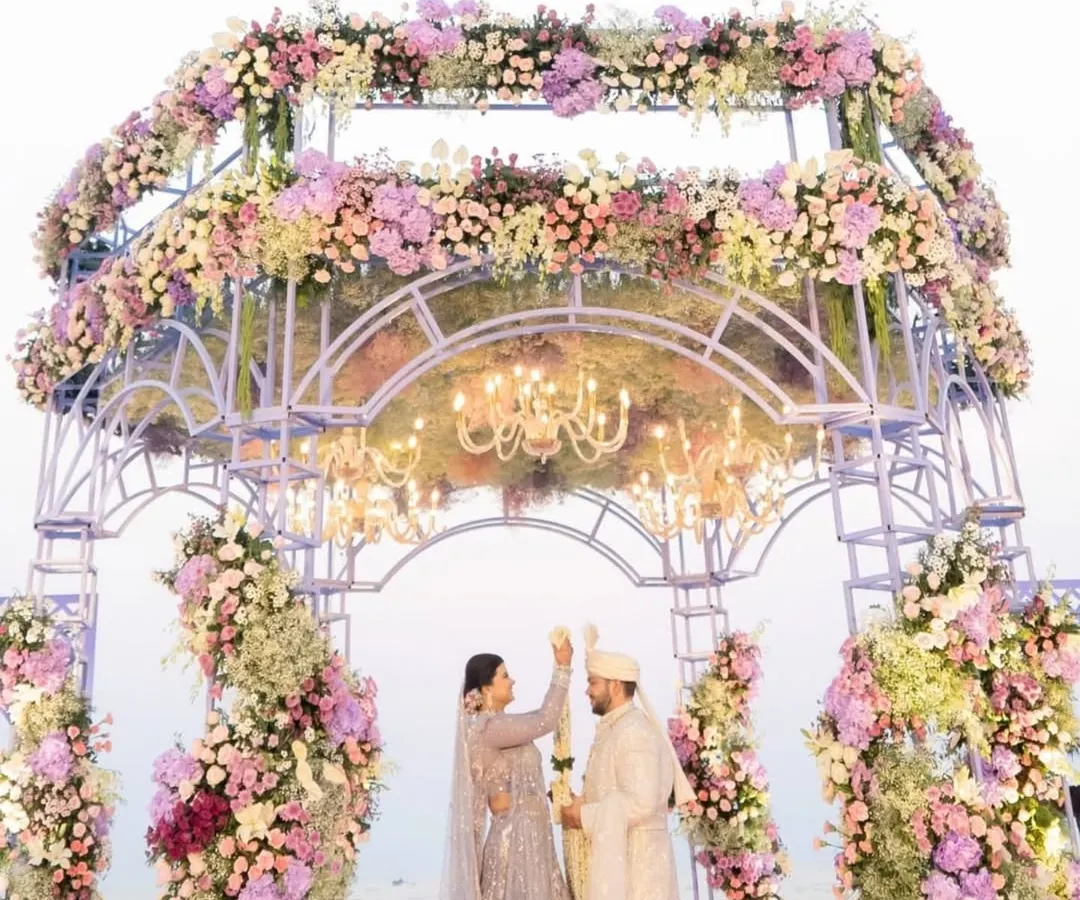 There's nothing more romantic than a beach wedding. This stunning floral mandap set against the serene ocean backdrop is perfect for couples who want their 'I do' moment to feel both grand and intimate.