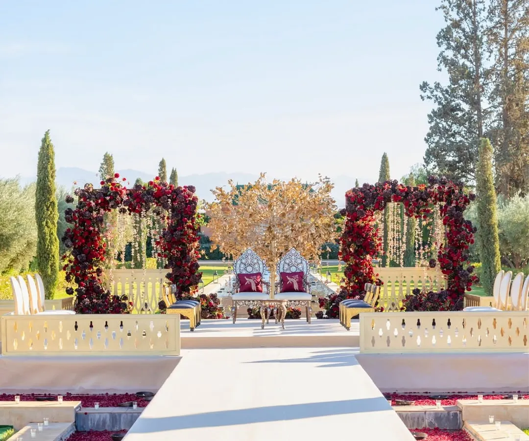 We believe a wedding should be an escape. For this Hindu ceremony, we created a fairytale setting at The Oberoi, Marrakech, with the snow-capped Atlas Mountains as a witness. The aisle was a grand canal, and the mandap featured a regal gold tree, blending Indian tradition with Moroccan splendor.
