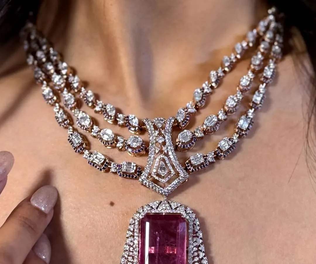 This is for the moments that demand pure grandeur. I designed this regal, multi-layered diamond necklace with a magnificent pink tourmaline as the centerpiece. It’s a true statement of bridal elegance and heritage craftsmanship.