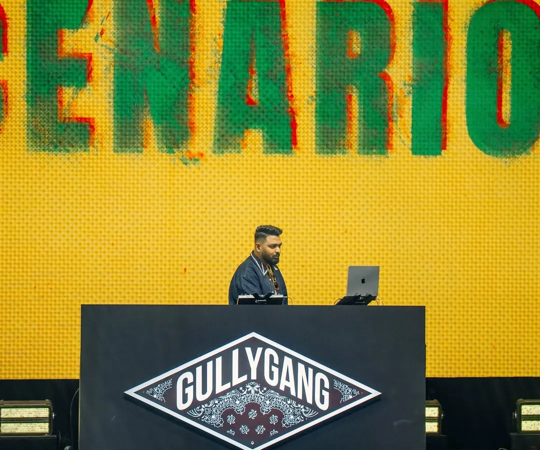 On the decks representing Gully Gang at the YouTube FanFest. This shot captures me in my element, focused on the music and the moment, with the iconic Gully Gang logo backing me up.