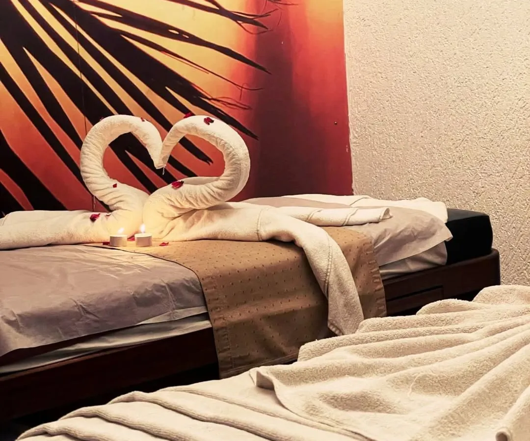 Our couples massage room is a private sanctuary designed for shared relaxation. It's the perfect setting to reconnect with a loved one while our therapists work to melt away your stress in a serene, candlelit ambiance.