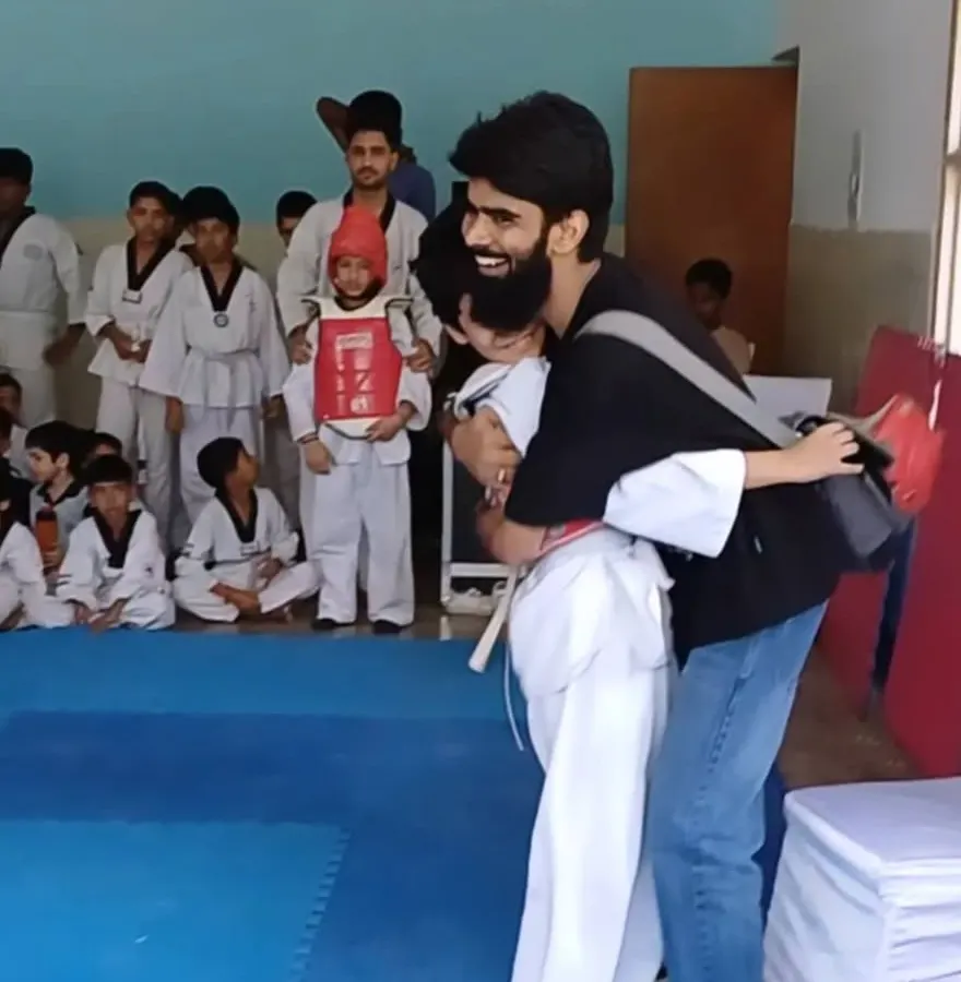 For me, coaching is more than teaching kicks and punches. It's about building trust and being a shield for my students, celebrating their courage in every step of their Taekwondo journey.