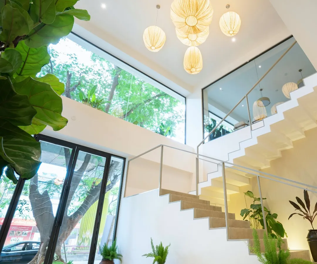 Welcome in. I wanted to create a space filled with natural light, clean lines, and plenty of plants. This is a glimpse of our Indiranagar cafe's Japandi-inspired staircase and airy, two-story design.