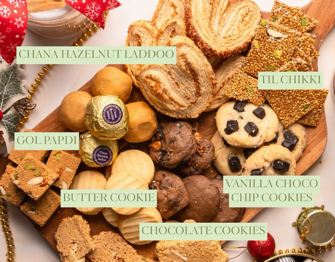 This is what my winter platters are all about. A beautiful wooden board filled with a variety of my best sellers like Palmiers, Til Chikki, Laddoos, and different kinds of cookies, perfect for any gathering.