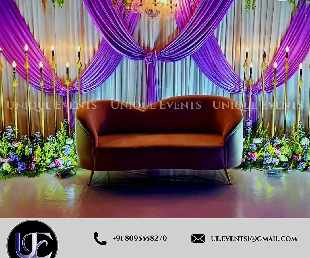 We designed this elegant stage for a formal corporate gathering. The setup features luxurious purple drapery, a central chandelier for sophisticated lighting, and custom floral arrangements to create a polished and high-end atmosphere perfect for awards ceremonies, gala dinners, or celebratory brand events.