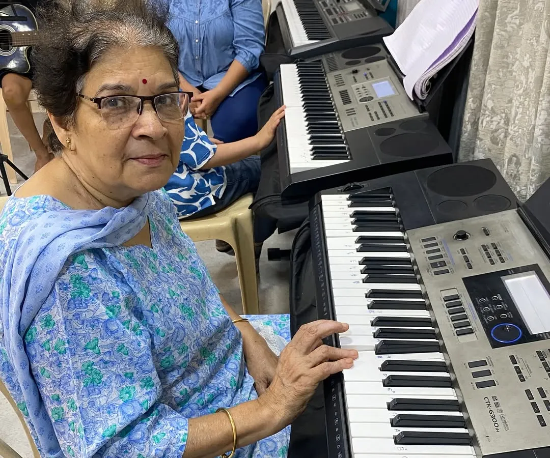 We welcome students of all ages, and it's a joy to see everyone discover their passion for music. This student is in one of our keyboard classes, proving that it's never too late to start learning a new skill.