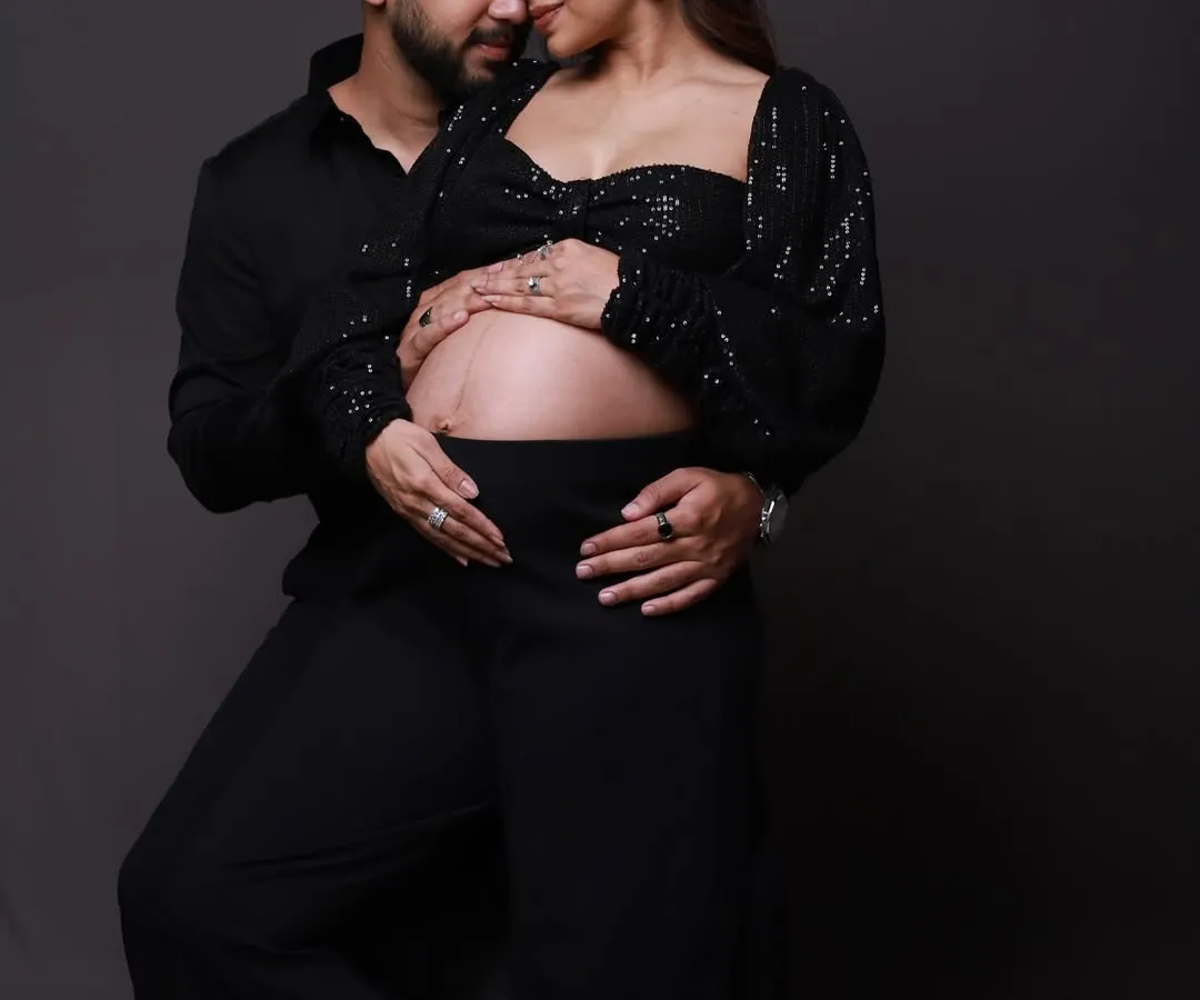 The quiet moments are often the most powerful. Here, we focused on the intimate connection between the parents-to-be in a modern, chic studio setting. It’s a simple pose that speaks volumes about their shared anticipation and love.