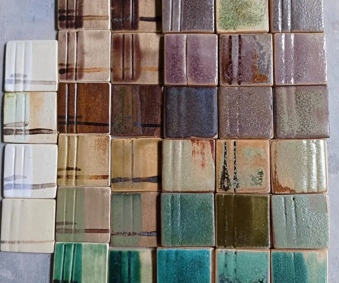 The magic of glaze chemistry, displayed in a library of test tiles. Each square represents countless hours of testing to perfect a color, texture, and finish. I provide these tested glazes and the knowledge to help you understand how they interact with different clay bodies and firing temperatures.