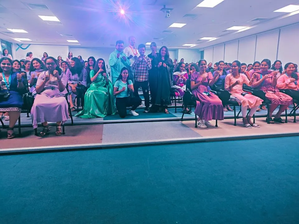 Here you can see the participants actively engaged in a practical exercise. Our workshops are not just lectures; they are hands-on training sessions where your team learns basic, effective self-defense stances and techniques in a safe and supportive environment.