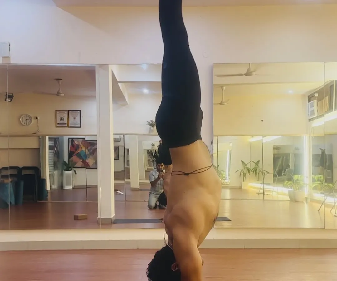 The practice of Adho Mukha Vrksasana, or handstand, requires abhyasa, which is dedicated and consistent effort. Here, I demonstrate the alignment and core engagement needed to hold the pose with stability and grace.
