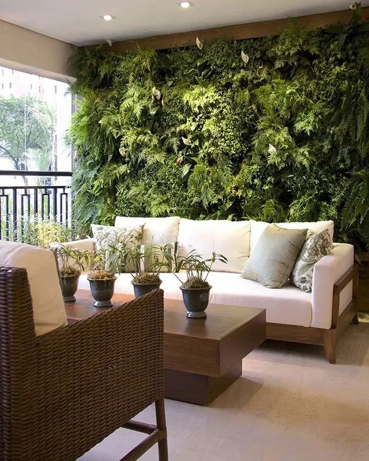 A lush, floor to ceiling live vertical garden transforms this covered balcony into an indoor oasis. We integrate these living walls seamlessly with your interior decor, creating a stunning natural feature that also helps purify the air.