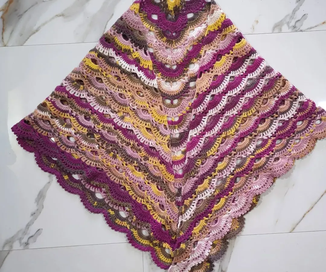 This is the beautiful and intricate Virus Shawl, a very popular pattern in the crochet community. I truly enjoyed watching the gorgeous colors of the papatya batik yarn unfold in these lacy, fan-like stitches. It creates a wonderfully light and airy wrap.