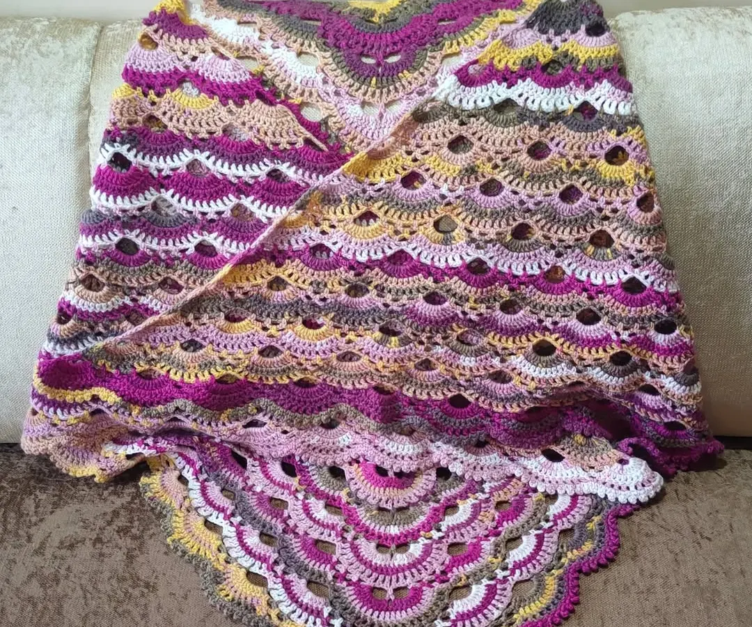 This is the famous 'Virus Shawl', and it's one of the most rewarding projects to complete. The intricate, lacy pattern looks complex, but I guide my students through each step to create their own gorgeous, flowing shawl using self-striping yarn.