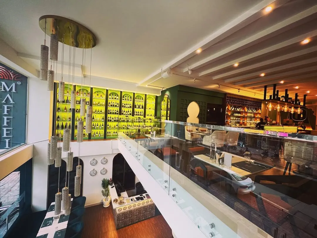 Welcome to our Mediterranean paradise. We designed the space to be modern, warm, and relaxing, featuring a stunning two-story wine display that sets the stage for an unforgettable fine dining experience.