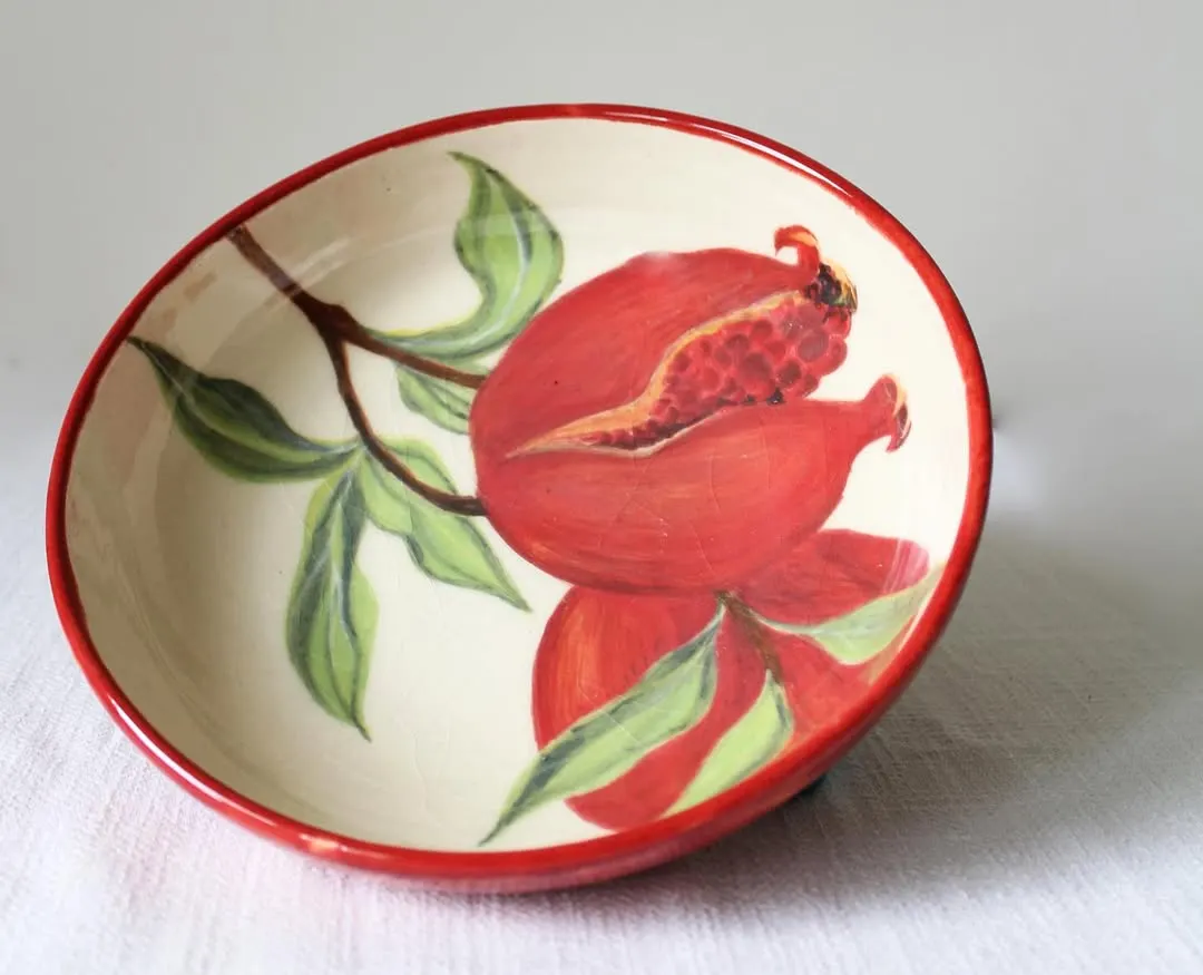 This hand-painted pomegranate bowl is a piece of functional art, bringing vibrant color and traditional motifs to your table. I shape and paint each one by hand, making it a truly one-of-a-kind treasure for your home.
