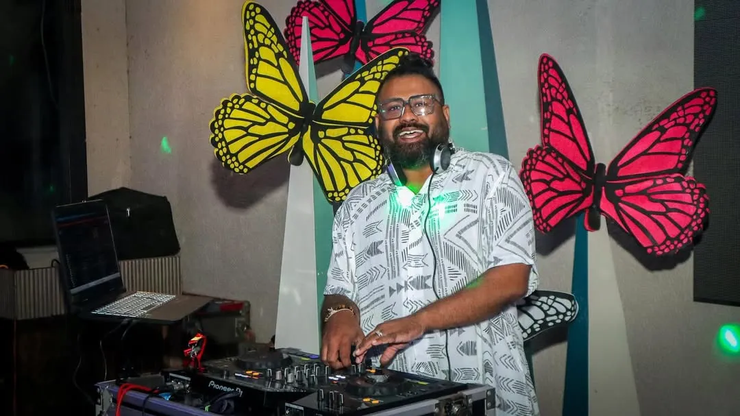 Here I am in my element, mixing tracks and feeling the crowd's energy. A clear shot of my DJ setup at a private party with a butterfly theme, ready to drop the next big hit.