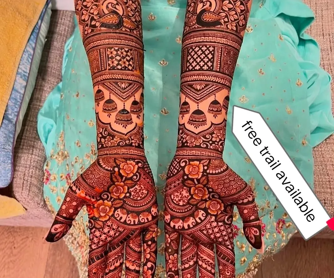 A complete bridal design that combines classic floral patterns with elegant peacock and jhumka (dangling earring) motifs. I offer a free trial so you can see my work and the quality of my henna stain for yourself, with no doubt.