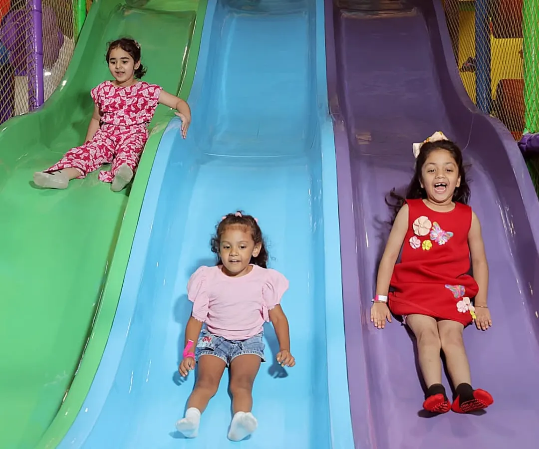 The pure joy of our multi-lane slides. Our indoor play area is designed for endless fun, with safe and exciting structures that let kids race, slide, and laugh all day long.