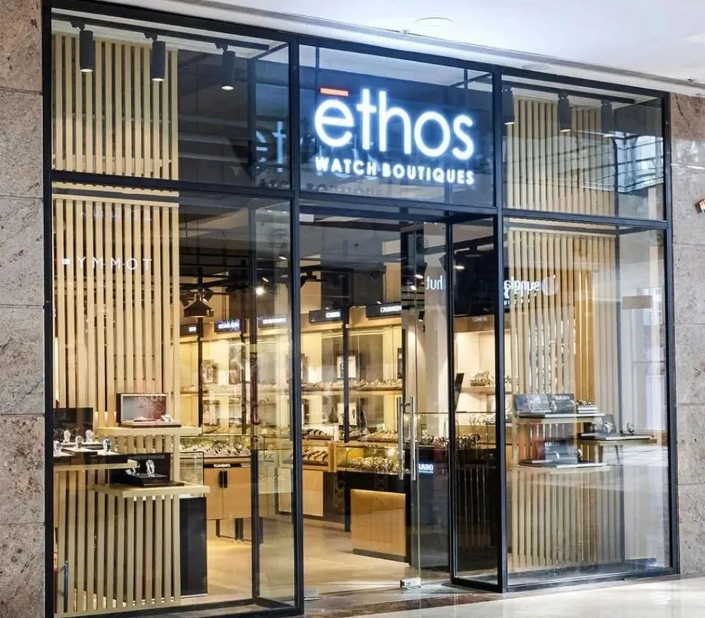 The striking facade of the Ethos Watch Boutiques in Guwahati. We used a combination of glass, blackened steel, and vertical wood slats to create a modern and inviting entrance that reflects the premium nature of the brands within.